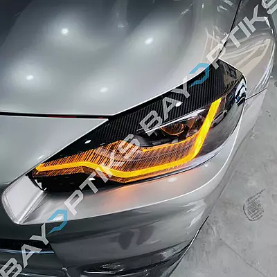 Dry Carbon Fiber Headlight Eyelid Eyebrow Trim – Fits BMW G87 M2 (2023–2025) Dry Carbon Fiber Headlight Eyelid Eyebrow Trim – Fits BMW G87 M2 (2023–2025)